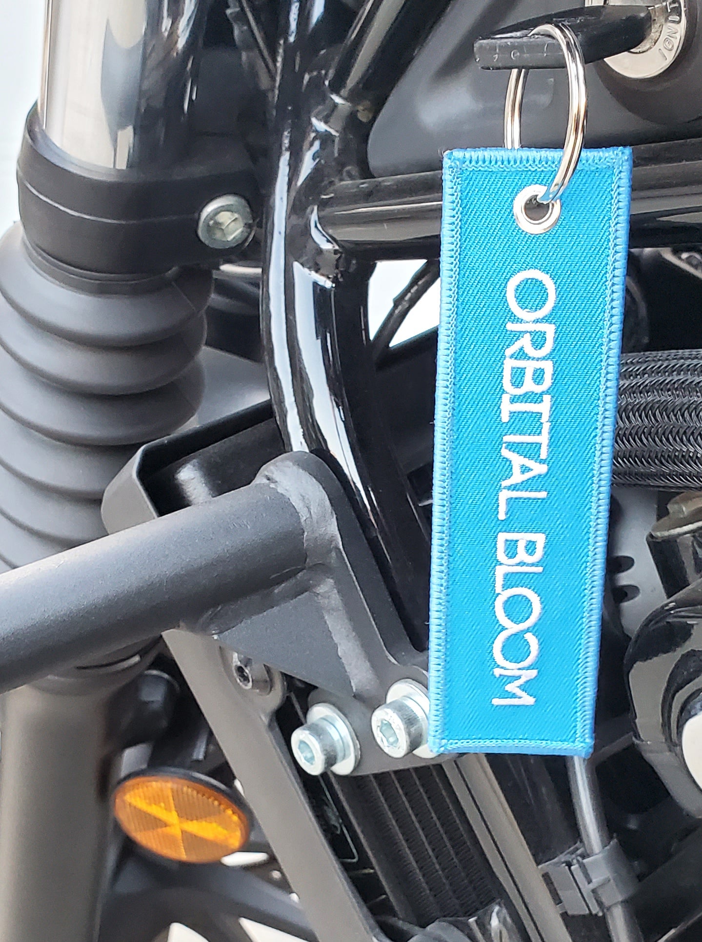 "ORBITAL BLOOM" Key Tag